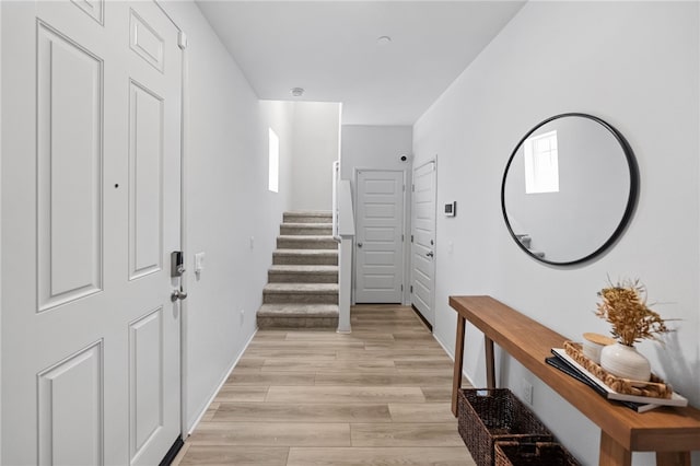 40545 Melrose Dr, Temecula, CA 92591 - foyer entrance with stairway, light wood-style floors, and baseboards