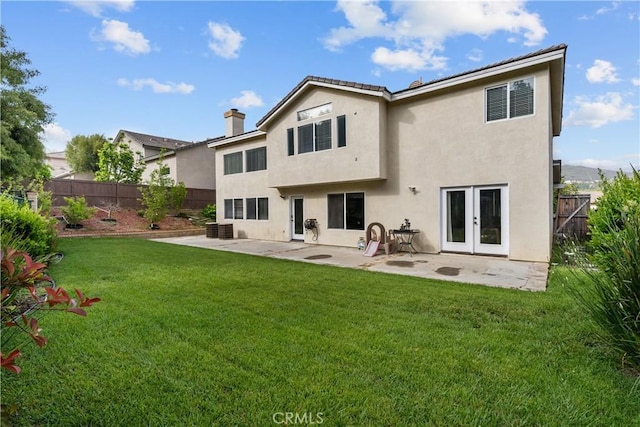 26426 Cardinal Dr, Canyon Country, CA 91387 - back of house featuring a patio area, a chimney, and stucco siding