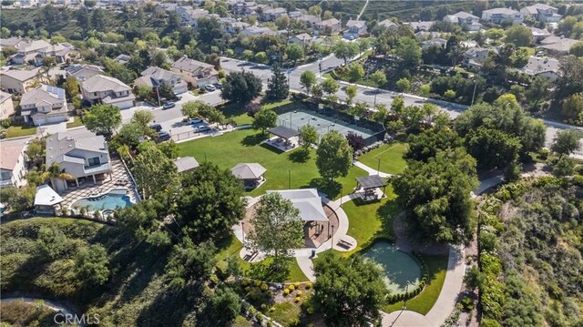 26426 Cardinal Dr, Canyon Country, CA 91387 - aerial overview of property's location with a pool area and nearby suburban area