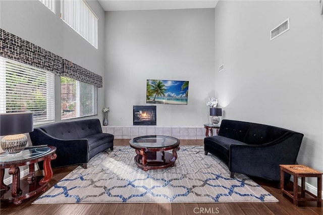 26426 Cardinal Dr, Canyon Country, CA 91387 - living area featuring a high ceiling, a tile fireplace, and wood finished floors