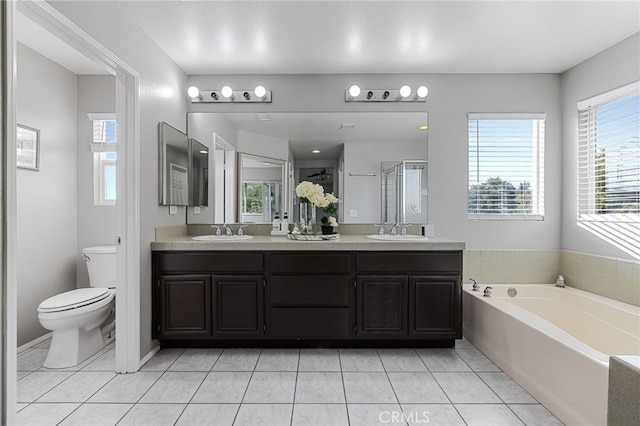26426 Cardinal Dr, Canyon Country, CA 91387 - bathroom with tile patterned floors, double vanity, a stall shower, toilet, and a garden tub
