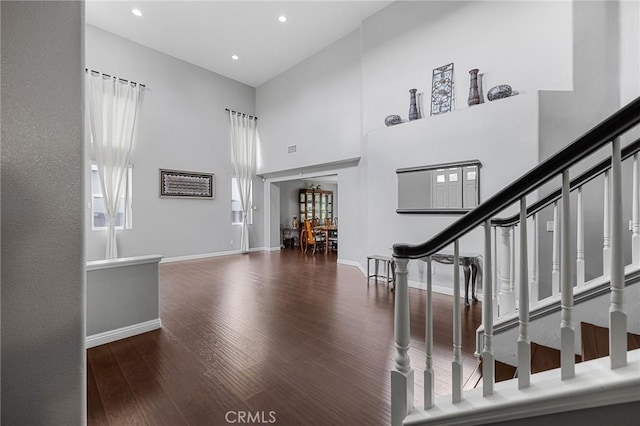 26426 Cardinal Dr, Canyon Country, CA 91387 - entrance foyer with wood finished floors, a high ceiling, baseboards, recessed lighting, and stairs