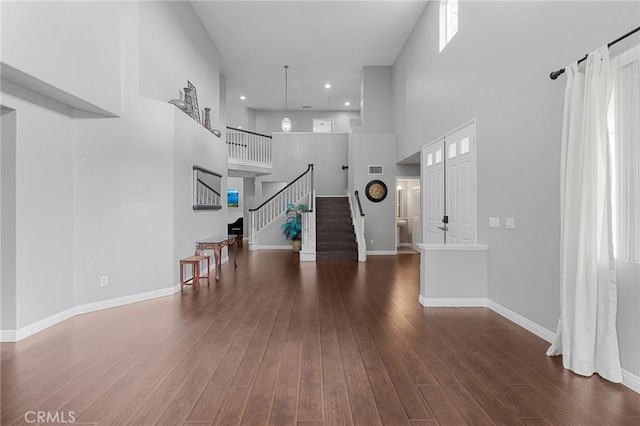 26426 Cardinal Dr, Canyon Country, CA 91387 - living area with a high ceiling, stairs, wood finished floors, baseboards, and recessed lighting
