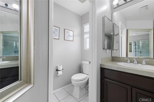 26426 Cardinal Dr, Canyon Country, CA 91387 - bathroom with tile patterned flooring, toilet, vanity, and baseboards