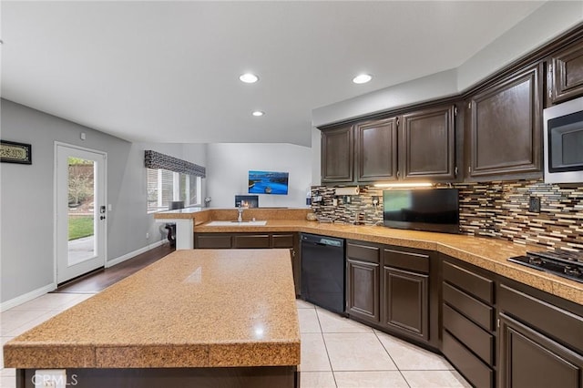 26426 Cardinal Dr, Canyon Country, CA 91387 - kitchen with black appliances, light tile patterned flooring, backsplash, dark brown cabinets, and recessed lighting