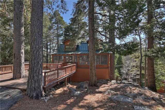26638 Lake Forest Dr, Twin Peaks, CA 92391 - rear view of house with a wooden deck and metal roof