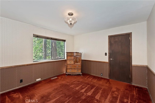 26638 Lake Forest Dr, Twin Peaks, CA 92391 - carpeted spare room with wallpapered walls and a wainscoted wall