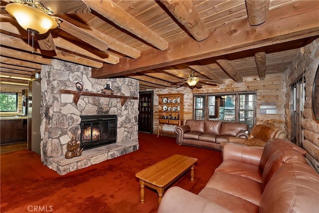 26638 Lake Forest Dr, Twin Peaks, CA 92391 - living area with ceiling fan, wooden ceiling, a stone fireplace, beamed ceiling, and wood walls