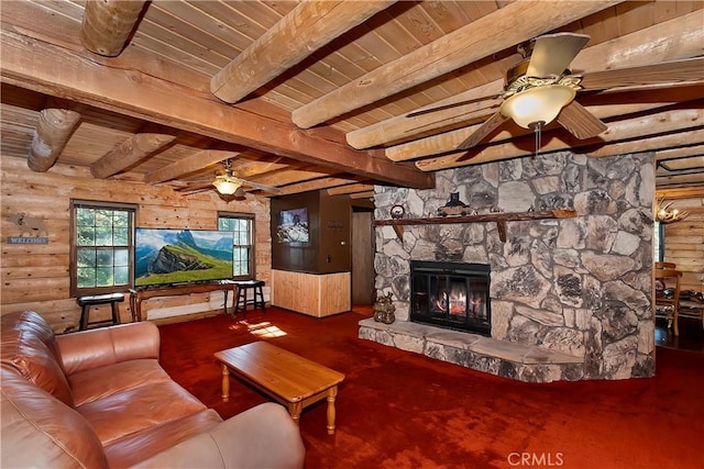 26638 Lake Forest Dr, Twin Peaks, CA 92391 - living room featuring ceiling fan, wood ceiling, a stone fireplace, beam ceiling, and wooden walls