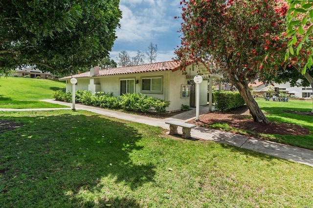 816 Caminito Azul, Carlsbad, CA 92011 - view of front of home featuring a tile roof, stucco siding, and a front yard