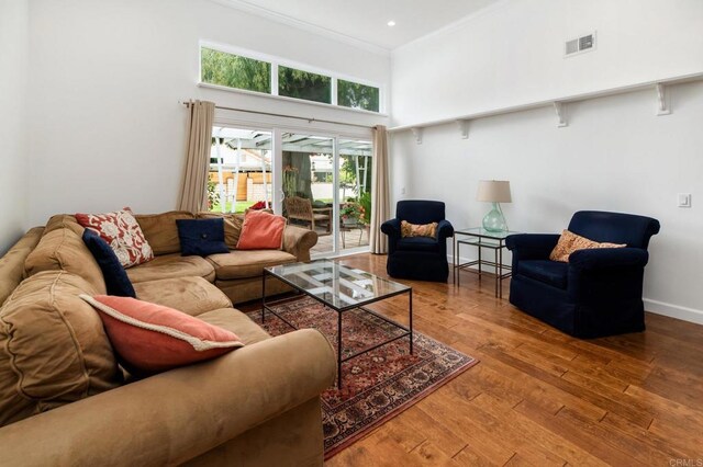 816 Caminito Azul, Carlsbad, CA 92011 - living room featuring a towering ceiling, wood-type flooring, crown molding, recessed lighting, and baseboards