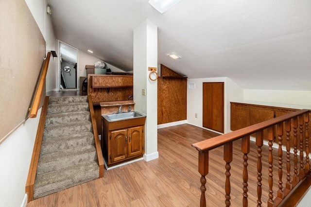 816 Caminito Azul, Carlsbad, CA 92011 - staircase with wood finished floors, vaulted ceiling, and baseboards