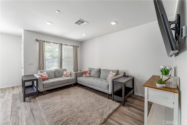 7155 Citrus Ave Unit 315, Fontana, CA 92336 - living area with light wood finished floors, baseboards, and recessed lighting