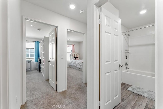 7155 Citrus Ave Unit 315, Fontana, CA 92336 - corridor featuring plenty of natural light and light carpet