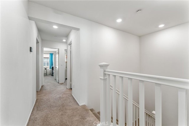 7155 Citrus Ave Unit 315, Fontana, CA 92336 - corridor featuring light colored carpet, an upstairs landing, recessed lighting, and baseboards