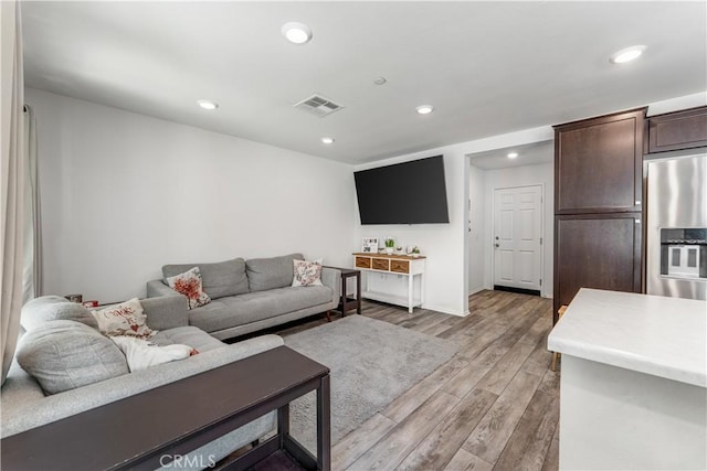 7155 Citrus Ave Unit 315, Fontana, CA 92336 - living room featuring light wood-style flooring and recessed lighting