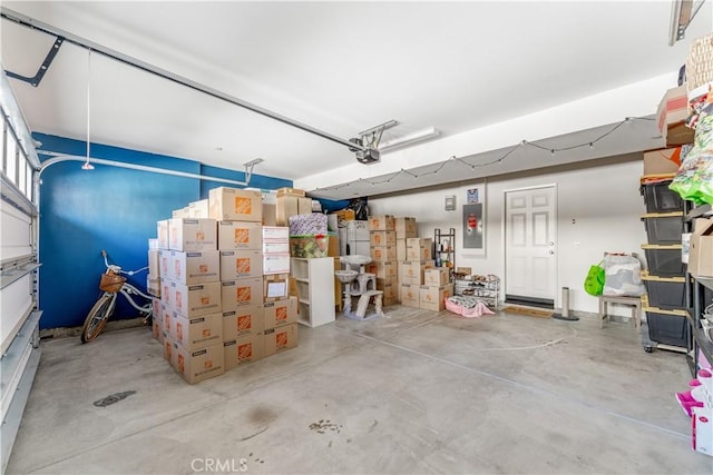7155 Citrus Ave Unit 315, Fontana, CA 92336 - garage featuring a garage door opener and electric panel