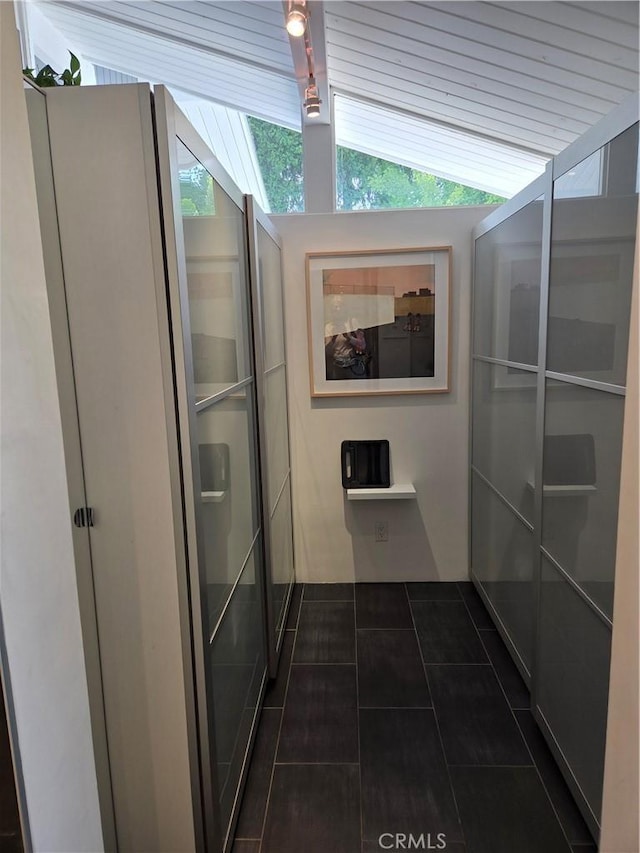 28715 Crestridge Rd, Rancho Palos Verdes, CA 90275 - corridor featuring dark tile patterned floors and lofted ceiling