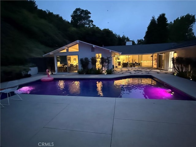 28715 Crestridge Rd, Rancho Palos Verdes, CA 90275 - pool at night with a patio area and an outdoor pool