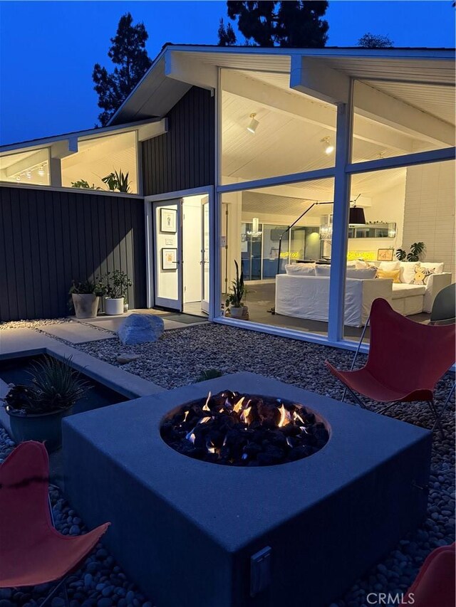 28715 Crestridge Rd, Rancho Palos Verdes, CA 90275 - back of house with an outdoor living space with a fire pit