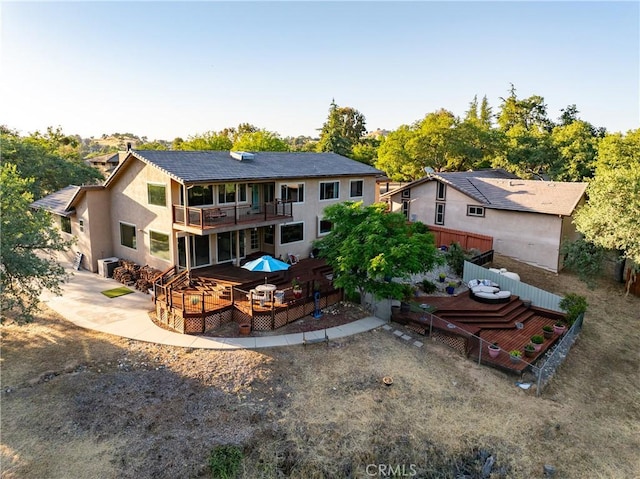 5145 Northfork Pl, Paso Robles, CA 93446 - rear view of house featuring a balcony, a deck, stucco siding, and a patio
