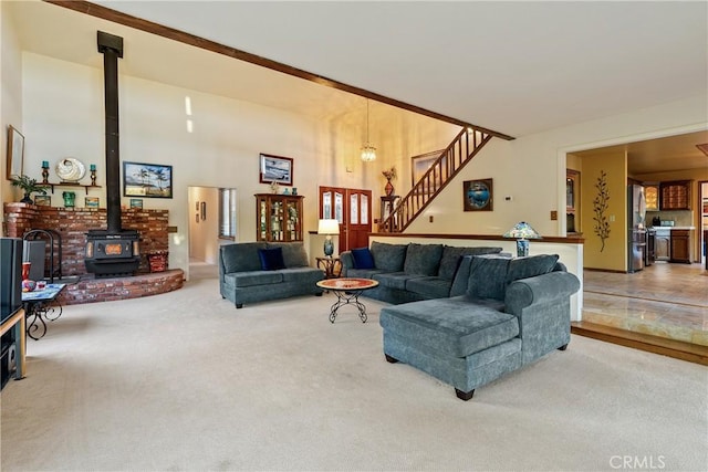 5145 Northfork Pl, Paso Robles, CA 93446 - carpeted living room with a wood stove, stairs, and a chandelier