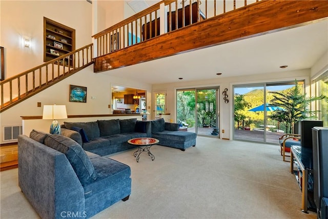 5145 Northfork Pl, Paso Robles, CA 93446 - carpeted living room with healthy amount of natural light, stairs, and a towering ceiling