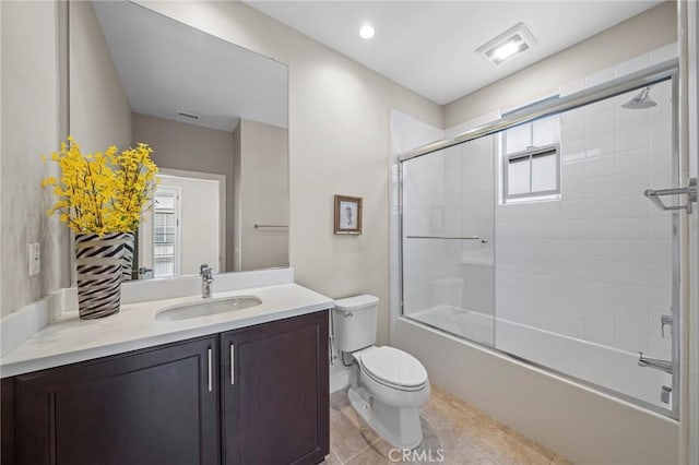 124 Trumpet Flower, Irvine, CA 92618 - bathroom featuring toilet, vanity, combined bath / shower with glass door, and tile patterned flooring
