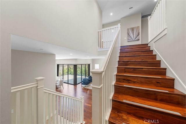 124 Trumpet Flower, Irvine, CA 92618 - stairs with wood finished floors, recessed lighting, and a high ceiling