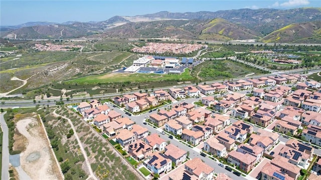 124 Trumpet Flower, Irvine, CA 92618 - aerial view of property and surrounding area featuring mountains and nearby suburban area