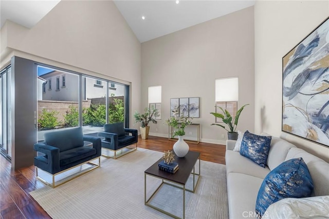 124 Trumpet Flower, Irvine, CA 92618 - living area featuring high vaulted ceiling, wood finished floors, baseboards, and recessed lighting