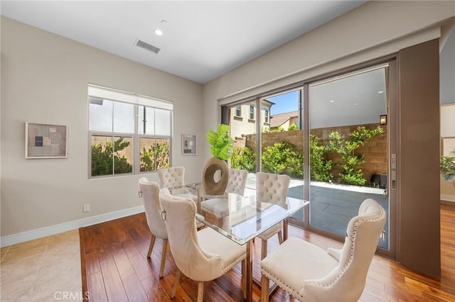 124 Trumpet Flower, Irvine, CA 92618 - dining space featuring healthy amount of natural light, wood finished floors, and baseboards