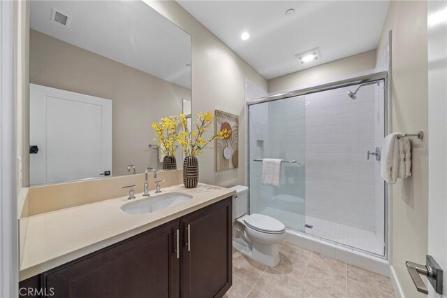 124 Trumpet Flower, Irvine, CA 92618 - full bath featuring a shower stall, toilet, vanity, and tile patterned flooring