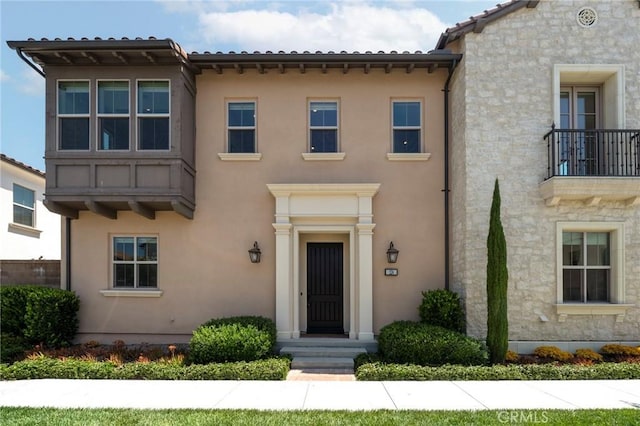 124 Trumpet Flower, Irvine, CA 92618 - view of front of property with stucco siding and stone siding