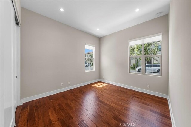 124 Trumpet Flower, Irvine, CA 92618 - spare room with healthy amount of natural light, baseboards, wood finished floors, and recessed lighting