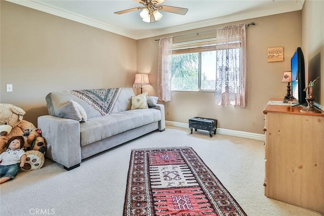living room featuring carpet flooring, ceiling fan, ornamental molding, and baseboards