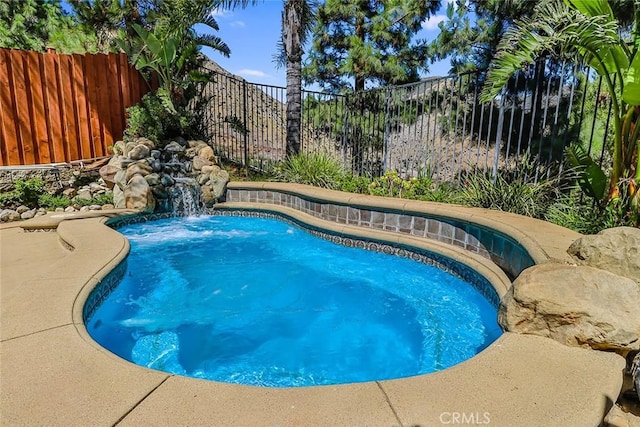 view of pool featuring a fenced backyard