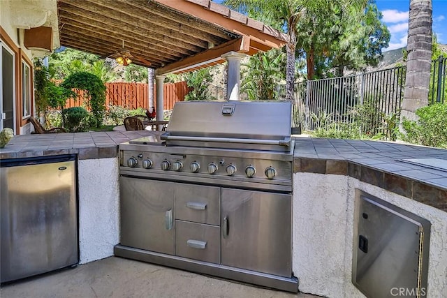 view of patio / terrace featuring fence and area for grilling
