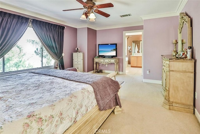 bedroom featuring light colored carpet, ornamental molding, baseboards, a ceiling fan, and connected bathroom