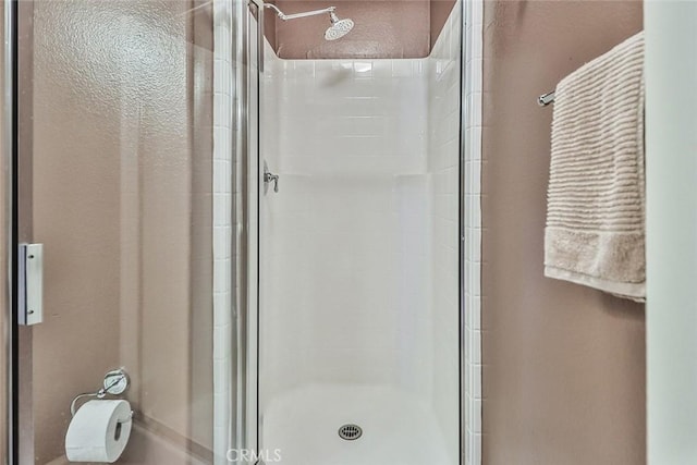 bathroom with a stall shower