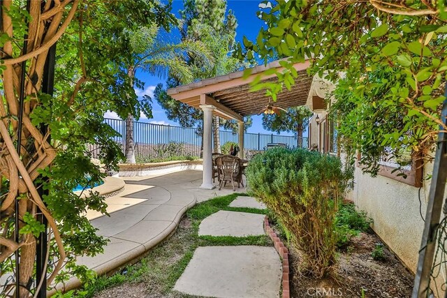 fenced backyard featuring a patio area and a pergola