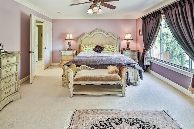 bedroom featuring light carpet, baseboards, ornamental molding, and a ceiling fan