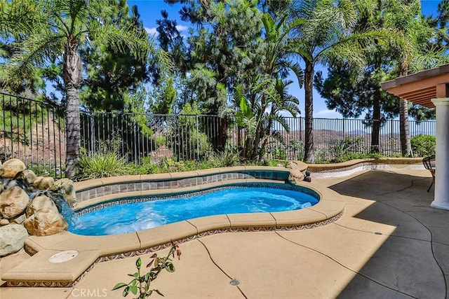 view of pool with a fenced backyard, a swimming pool, and a patio