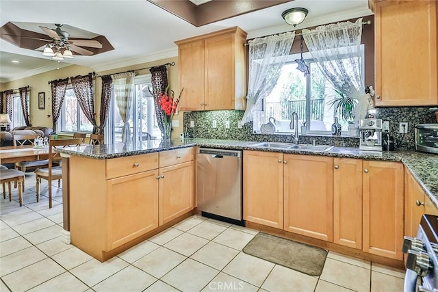 kitchen featuring dishwasher, a sink, ornamental molding, a peninsula, and a ceiling fan