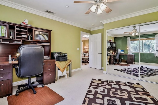 office with a ceiling fan, carpet, crown molding, and baseboards