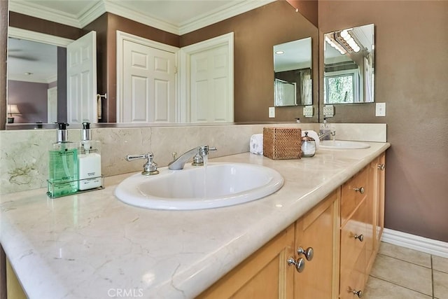 full bath with tile patterned floors, double vanity, and ornamental molding
