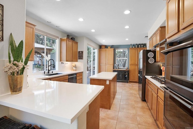 2217 Corte, San Simeon, Chula Vista, CA 91914 - kitchen featuring a sink, recessed lighting, a kitchen island, light countertops, and a peninsula