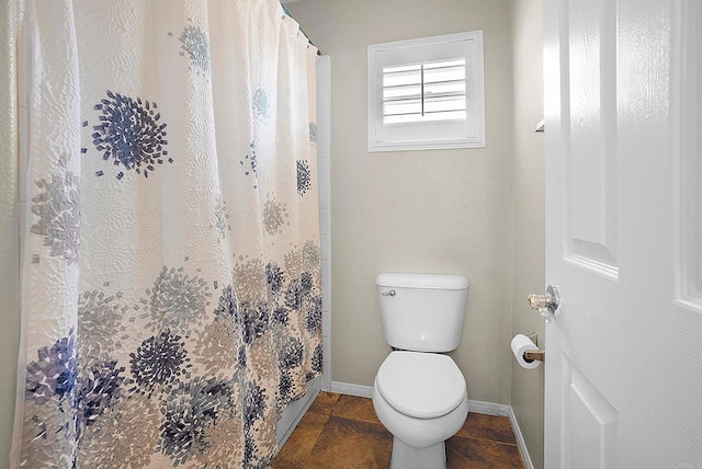 2217 Corte, San Simeon, Chula Vista, CA 91914 - full bathroom featuring baseboards, toilet, and curtained shower