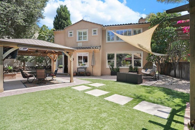 2217 Corte, San Simeon, Chula Vista, CA 91914 - back of property featuring a gazebo, stucco siding, a patio, outdoor lounge area, and a chimney
