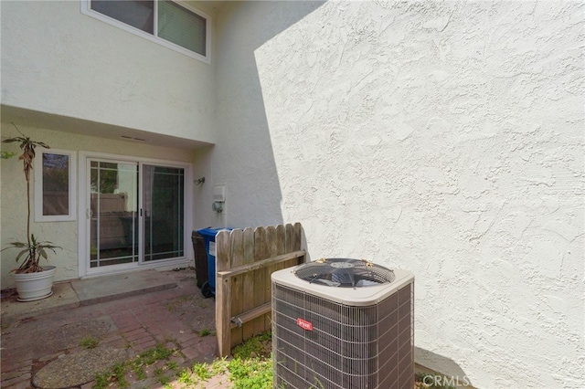 exterior view of stucco siding and cooling unit